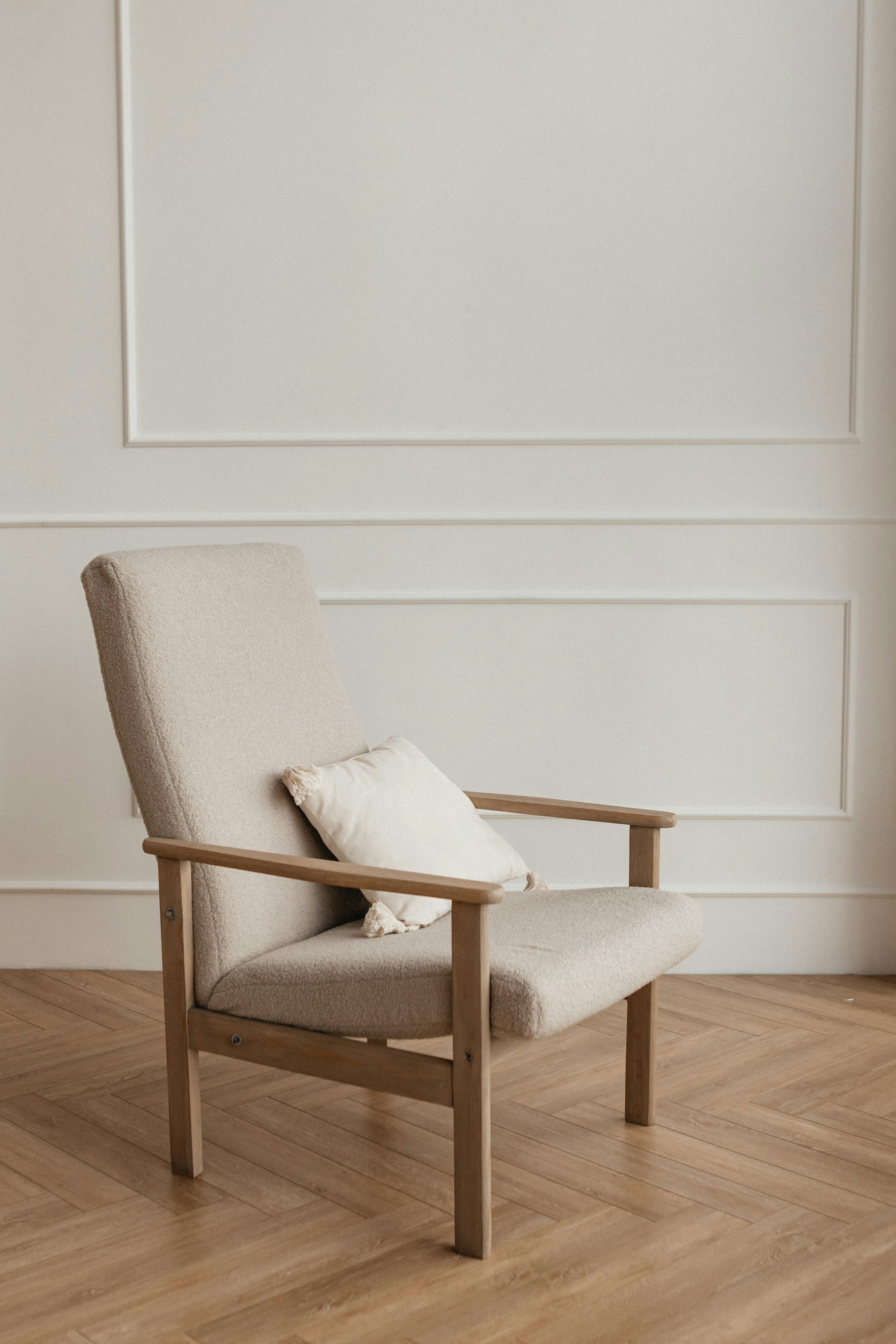 Well-proportioned lounge chair by a window
