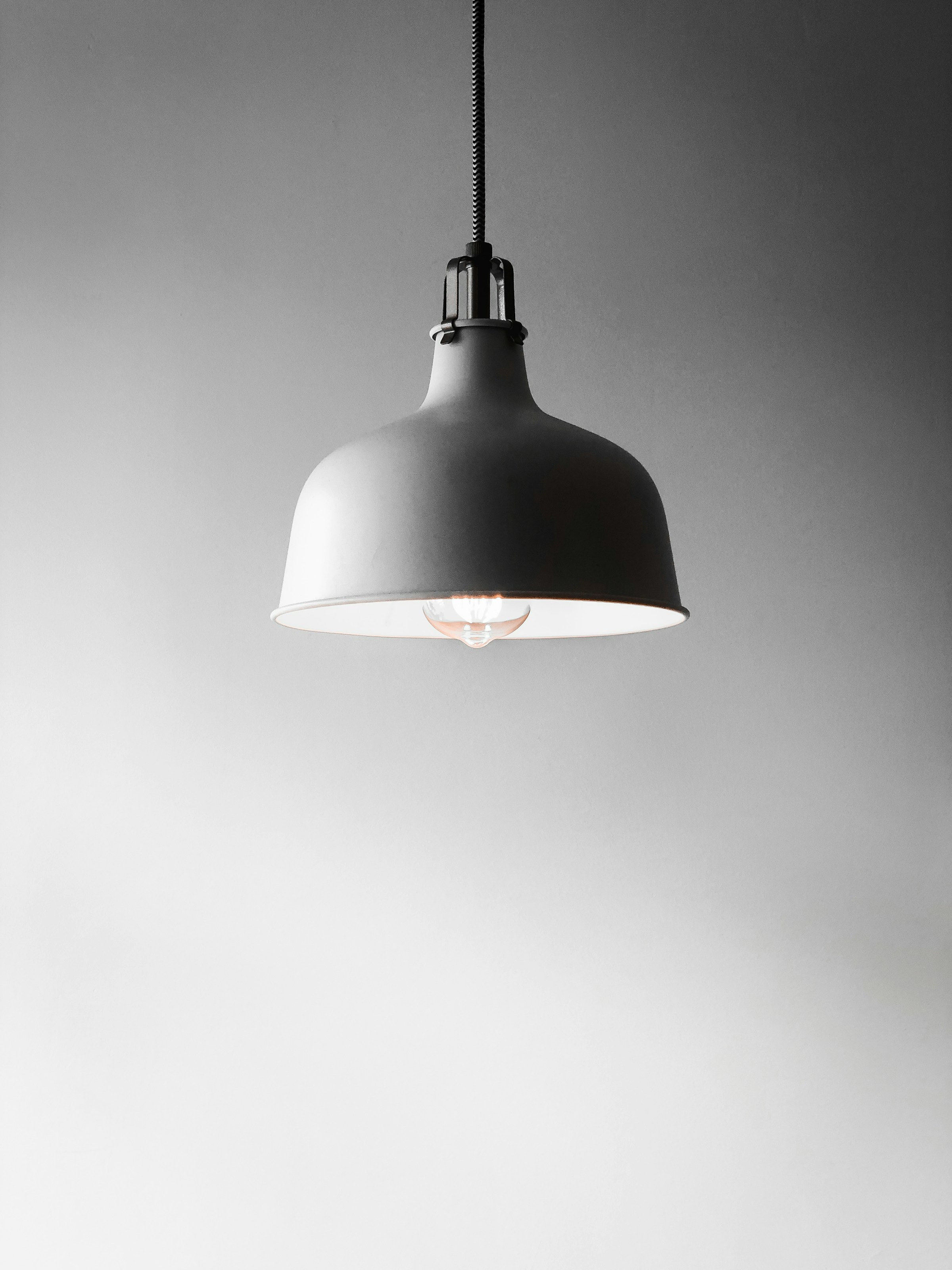 Sculptural pendant light over a table